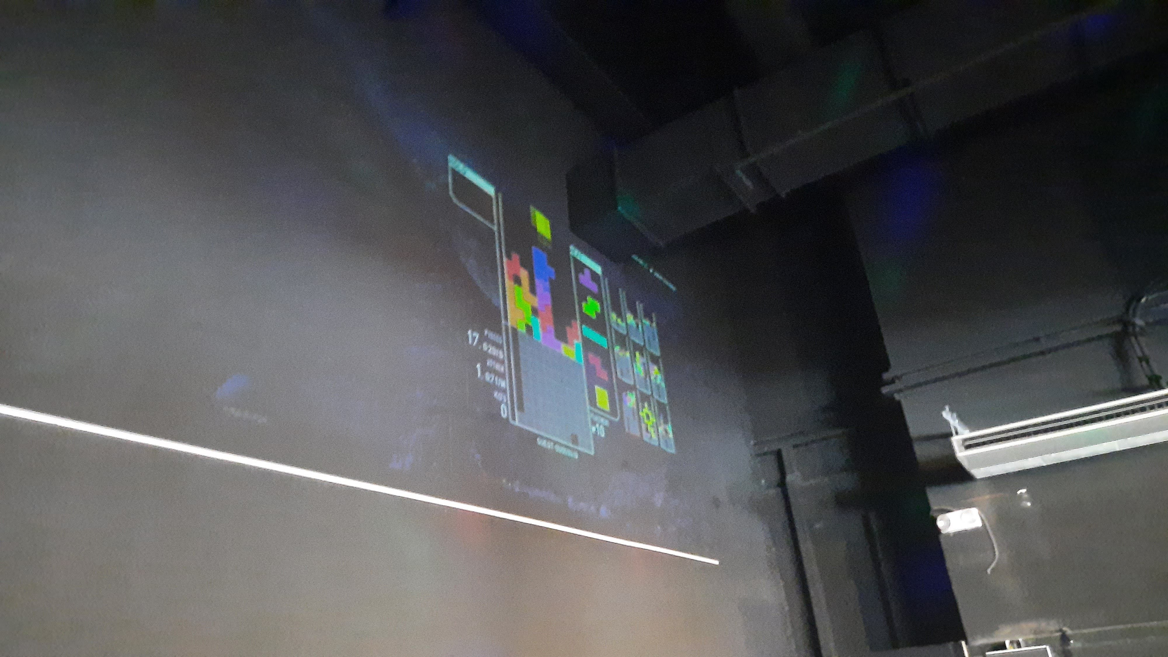 A wall with a projection of a Tetris game